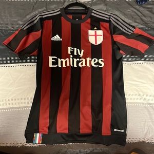 AC Milan Jersey with cross patch and multi color piece.